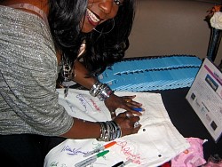 gramma funk signing wizard jeans for charity.jpg